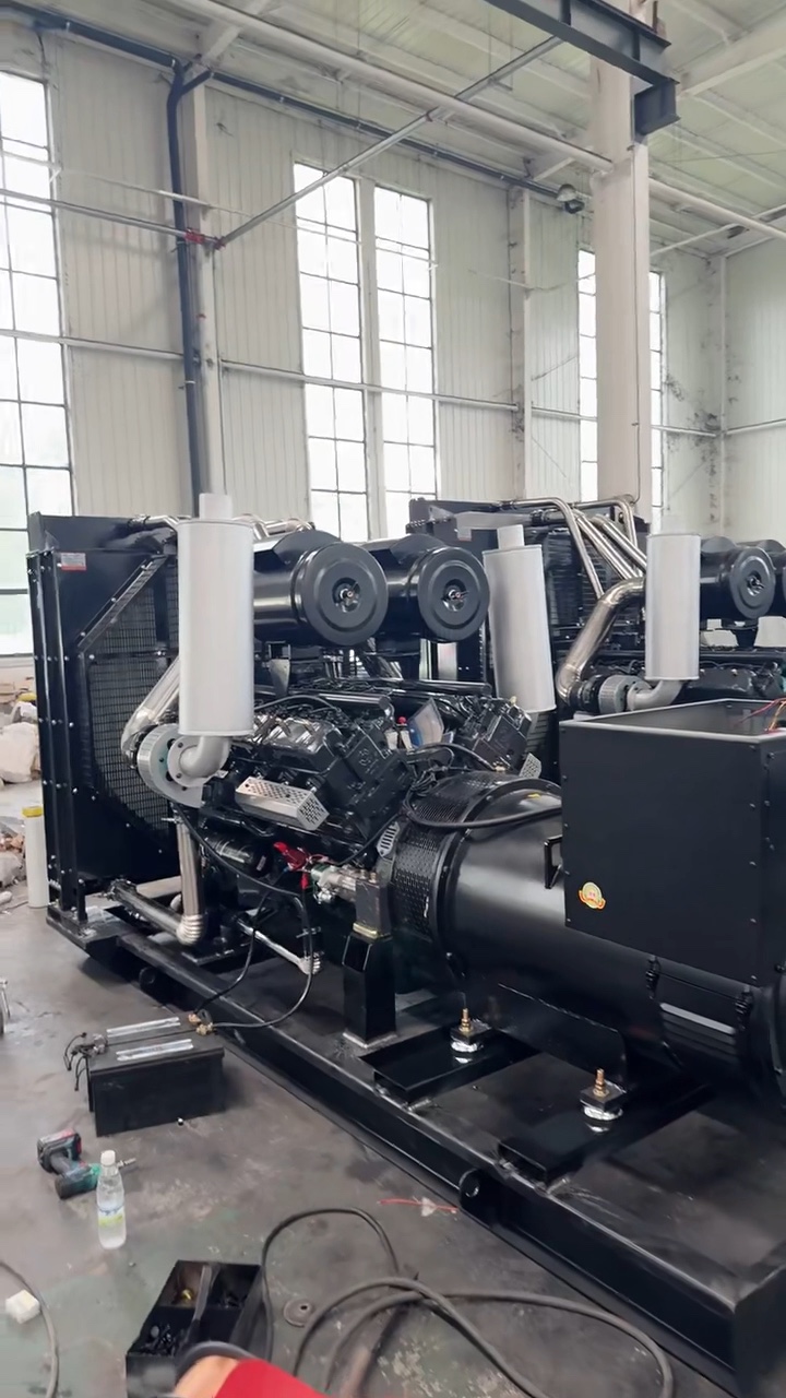 Open industrial generator set visible on the factory floor